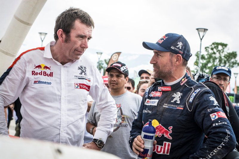 Stephane Peterhansel (FRA) of Team Peugeot TOTAL seen talking to team manager after his first win of Dakar 2017 in   San Salvador de Jujuy, Argentina on January 4, 2017